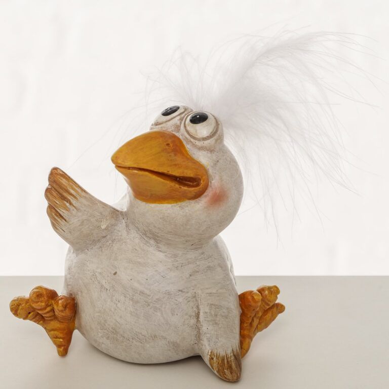 Vogel mit Glutschaugen und Feder auf dem Kopf